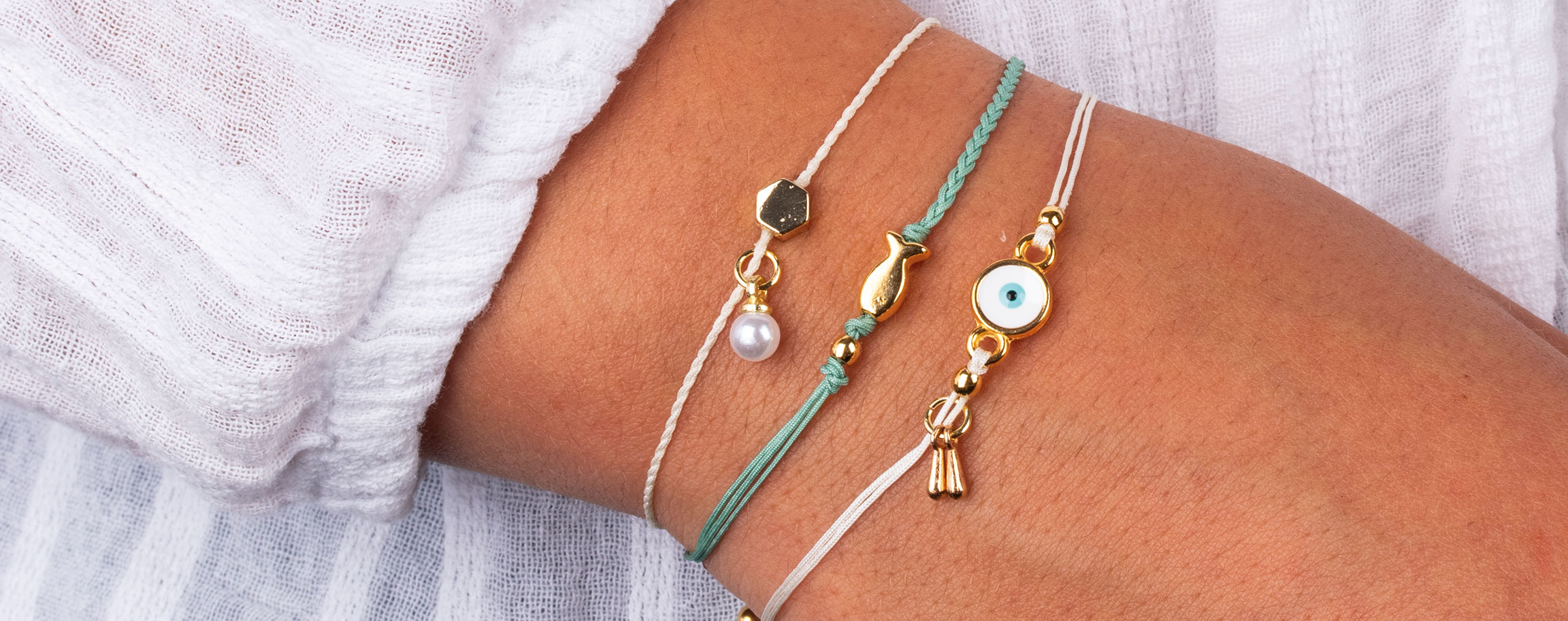 Friendship bracelets in white and green